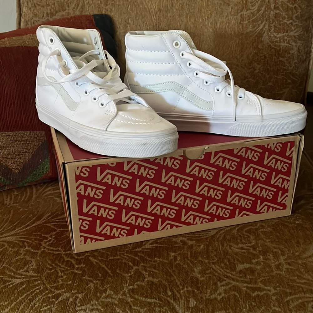 VANS while leather high tops Size 8 womenSize 6.5 men.  Very gently used.